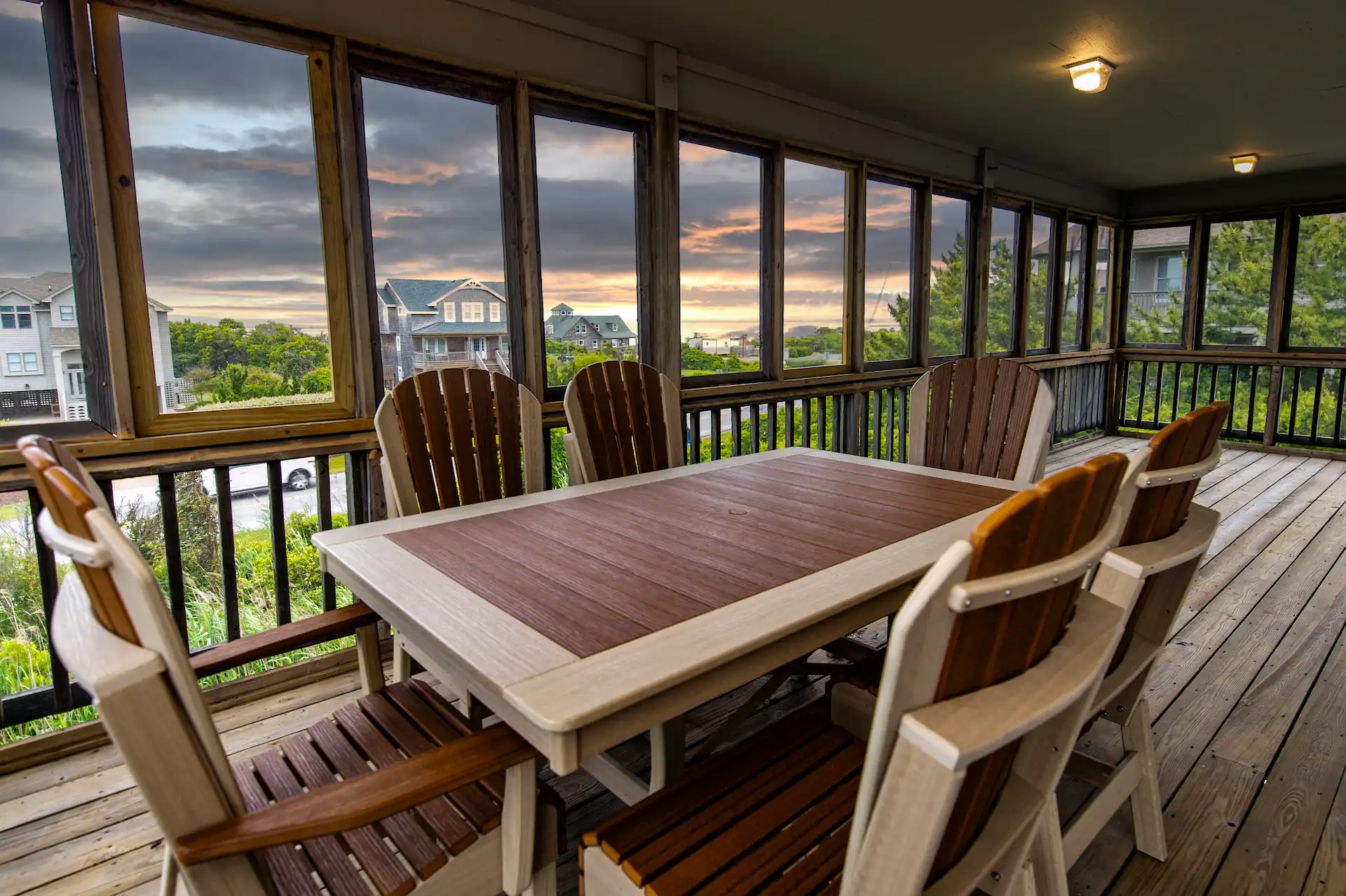 Covered terrace with large table and chairs at Sandpiper 4 Bedroom Residence.