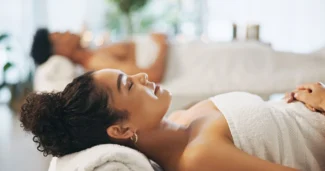 A couple enjoys a relaxing spa treatment at The Sanderling hotel