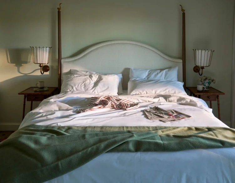 Spacious king-size bed in a Residence suite at The Sanderling Hotel, offering luxurious comfort and relaxation